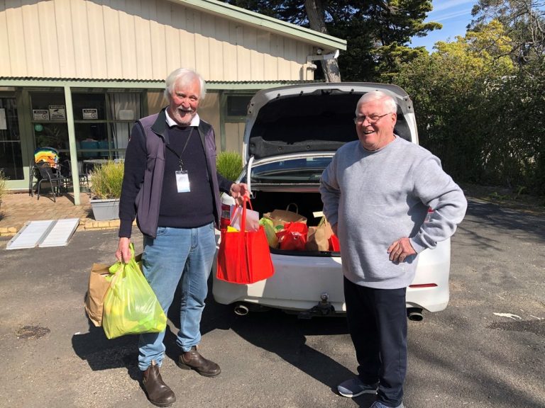 Volunteers unloading a donation drop-off