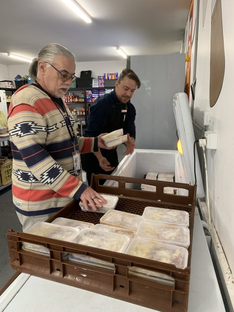 Packing the freezer with donated food