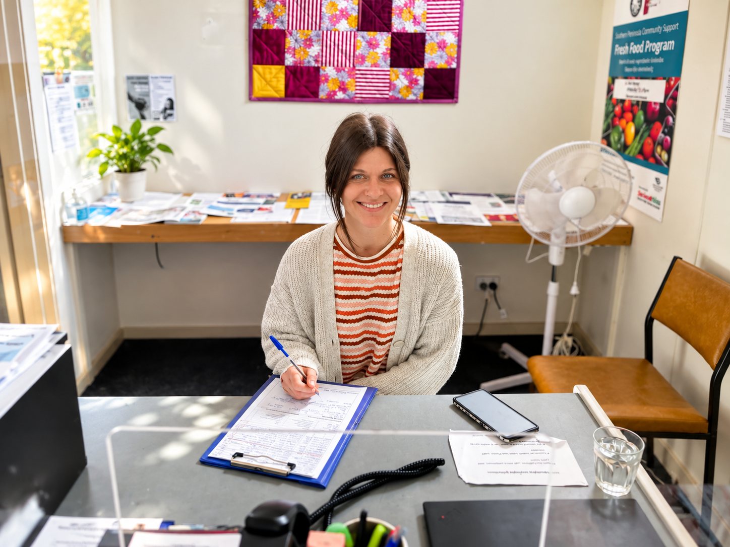 An SPCS support worker at her desk, ready to talk