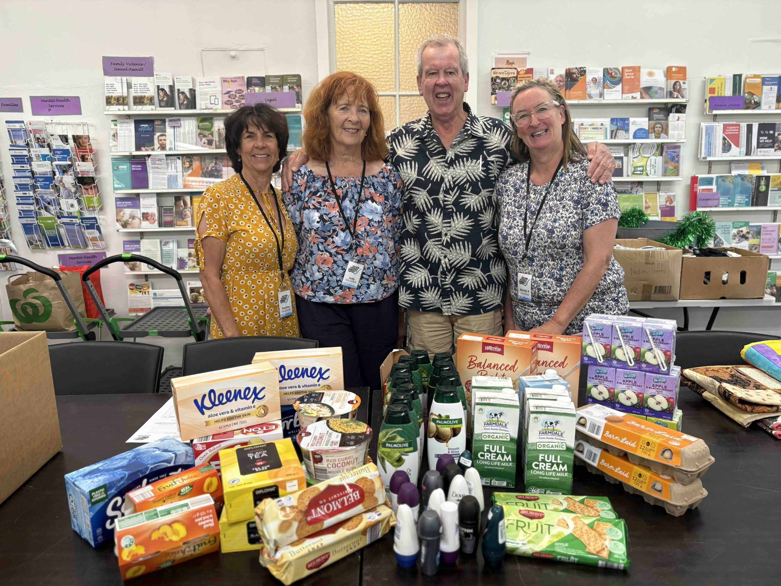 SPCS staff with donated food and household goods