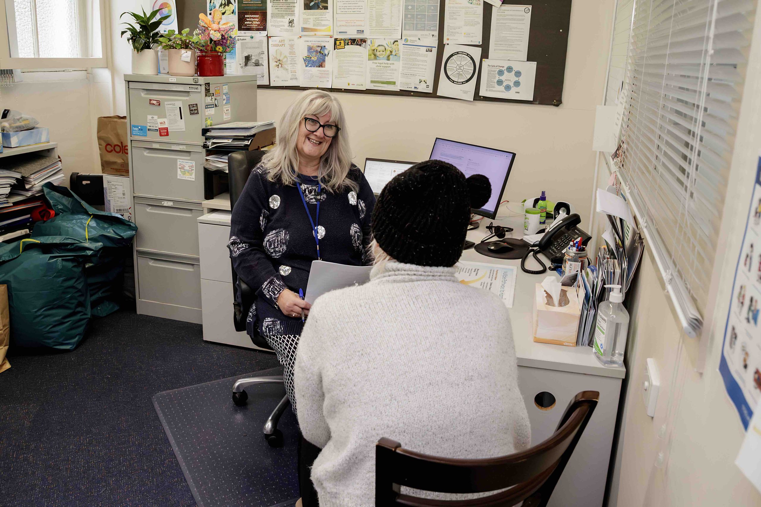 An SPCS support worker talking with someone at the Rosebud centre